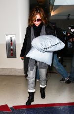 ALYSSA MILANO and Her Pillows at LAX Airport