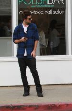 ASHLEY BENSON in Knee High Boots Out Shopping in Hollywood