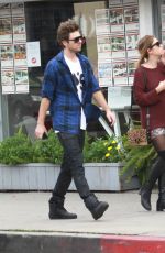 ASHLEY BENSON in Knee High Boots Out Shopping in Hollywood