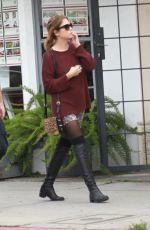 ASHLEY BENSON in Knee High Boots Out Shopping in Hollywood