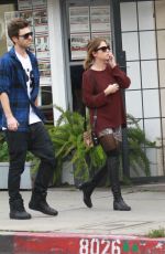 ASHLEY BENSON in Knee High Boots Out Shopping in Hollywood