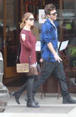 ASHLEY BENSON in Knee High Boots Out Shopping in Hollywood
