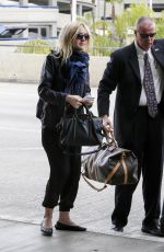 DAKOTA FANNING at LAX AIrport in Los Angeles