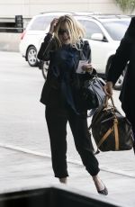 DAKOTA FANNING at LAX AIrport in Los Angeles