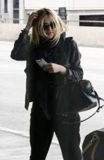 DAKOTA FANNING at LAX AIrport in Los Angeles