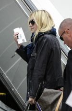 DAKOTA FANNING at LAX AIrport in Los Angeles