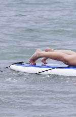 LEANN RIMES in Bikini Bottoms Trying to Paddleboarding in Mexico