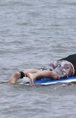 LEANN RIMES in Bikini Bottoms Trying to Paddleboarding in Mexico