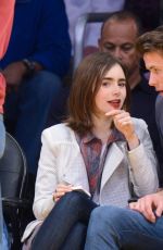 LILY COLLINS and Thomas Cocquerel at Lakers vs Bulls Game in Los Angeles