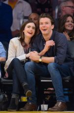 LILY COLLINS and Thomas Cocquerel at Lakers vs Bulls Game in Los Angeles