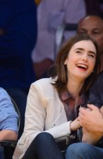 LILY COLLINS and Thomas Cocquerel at Lakers vs Bulls Game in Los Angeles
