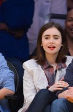 LILY COLLINS and Thomas Cocquerel at Lakers vs Bulls Game in Los Angeles