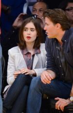 LILY COLLINS and Thomas Cocquerel at Lakers vs Bulls Game in Los Angeles