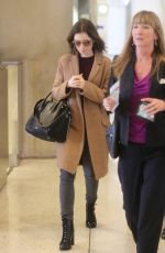 LILY COLLINS at LAX Airport in Los Angeles