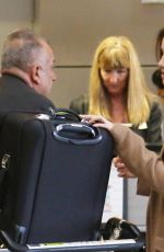 LILY COLLINS at LAX Airport in Los Angeles
