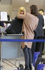 LILY COLLINS at LAX Airport in Los Angeles