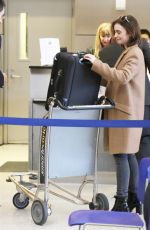 LILY COLLINS at LAX Airport in Los Angeles