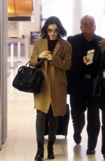 LILY COLLINS at LAX Airport in Los Angeles