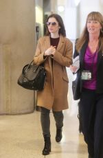 LILY COLLINS at LAX Airport in Los Angeles