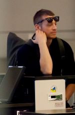 OLIVIA MUNN and Joel Kinnaman at LAX Airport