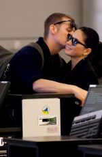 OLIVIA MUNN and Joel Kinnaman at LAX Airport