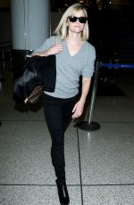 REESE WITHERSPOON Walks Through LAX Airport