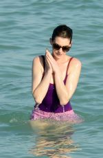 ANNE HATHAWAY in Swimsuit and Shorts in Miami
