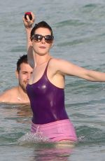 ANNE HATHAWAY in Swimsuit and Shorts in Miami
