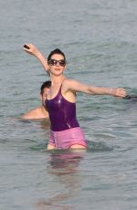 ANNE HATHAWAY in Swimsuit and Shorts in Miami