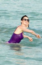 ANNE HATHAWAY in Swimsuit and Shorts in Miami