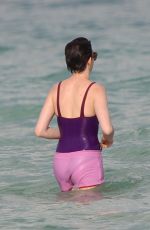 ANNE HATHAWAY in Swimsuit and Shorts in Miami