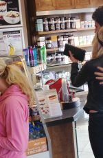 ASHLEY BENSON in jeans Out Shopping in Hollywood