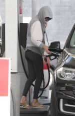 CHARLIEZE THERON at Gas Station after a Yoga Class in Los Angeles