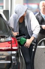 CHARLIEZE THERON at Gas Station after a Yoga Class in Los Angeles