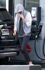 CHARLIEZE THERON at Gas Station after a Yoga Class in Los Angeles