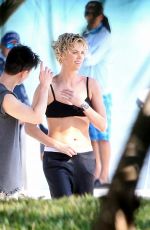 CHARLIZE THERON at a Photoshoot in Miami Beach