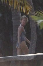 CHARLIZE THERON at a Photoshoot in Miami Beach