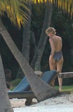 CHARLIZE THERON at a Photoshoot in Miami Beach