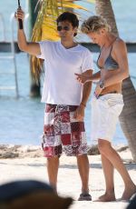 CHARLIZE THERON in Bikini at a Photoshoot on the Beach in Miami
