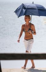 CHARLIZE THERON in Bikini at a Photoshoot on the Beach in Miami