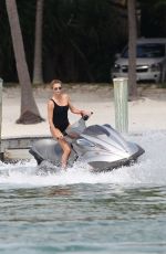 CHARLIZE THERON in Swimsuit at a Photoshoot in Miami