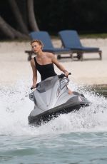 CHARLIZE THERON in Swimsuit at a Photoshoot in Miami