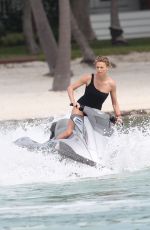 CHARLIZE THERON in Swimsuit at a Photoshoot in Miami