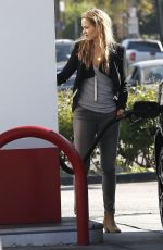 ELIZABETH BERKLEY at a Gas Station in Los Angeles