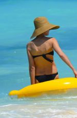 HEIDI KLUM in Bikini at a Beach in Bahamas