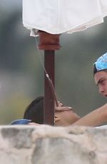 MICHELLE RODRIGUEZ and CARA DELEVINGNE Cuddle on a Beach