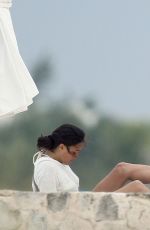 MICHELLE RODRIGUEZ and CARA DELEVINGNE Cuddle on a Beach