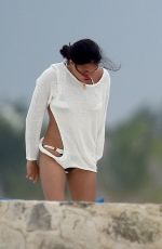 MICHELLE RODRIGUEZ and CARA DELEVINGNE Cuddle on a Beach