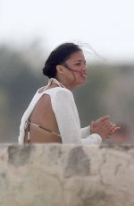MICHELLE RODRIGUEZ and CARA DELEVINGNE Cuddle on a Beach