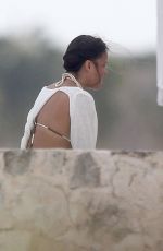 MICHELLE RODRIGUEZ and CARA DELEVINGNE Cuddle on a Beach